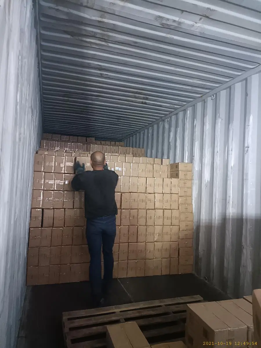 Cartons being loaded into a shipping container